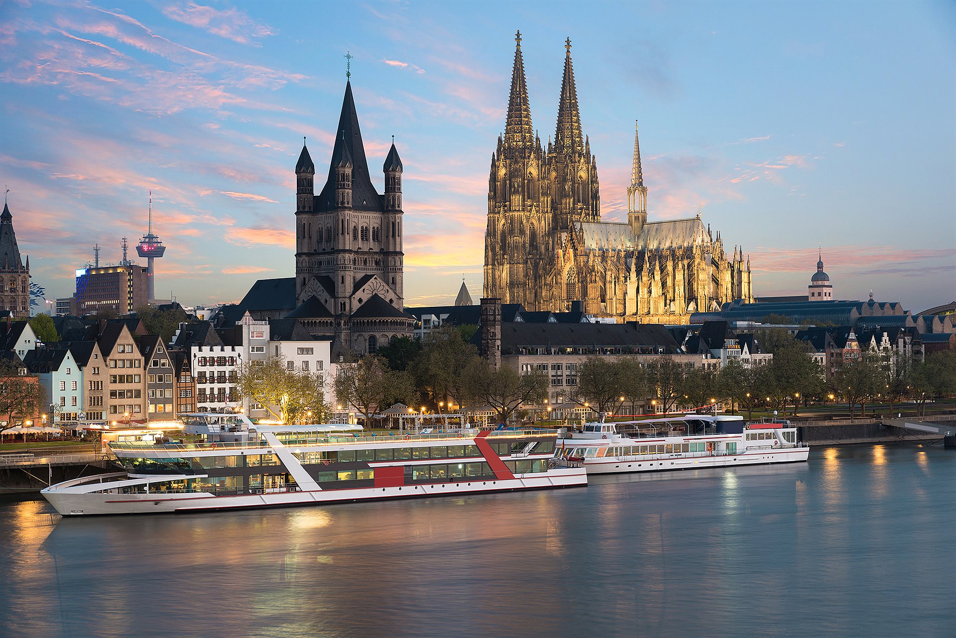 Accessible river cruise ship gliding past a European riverside town Accessible river cruise ship gliding past a European riverside town